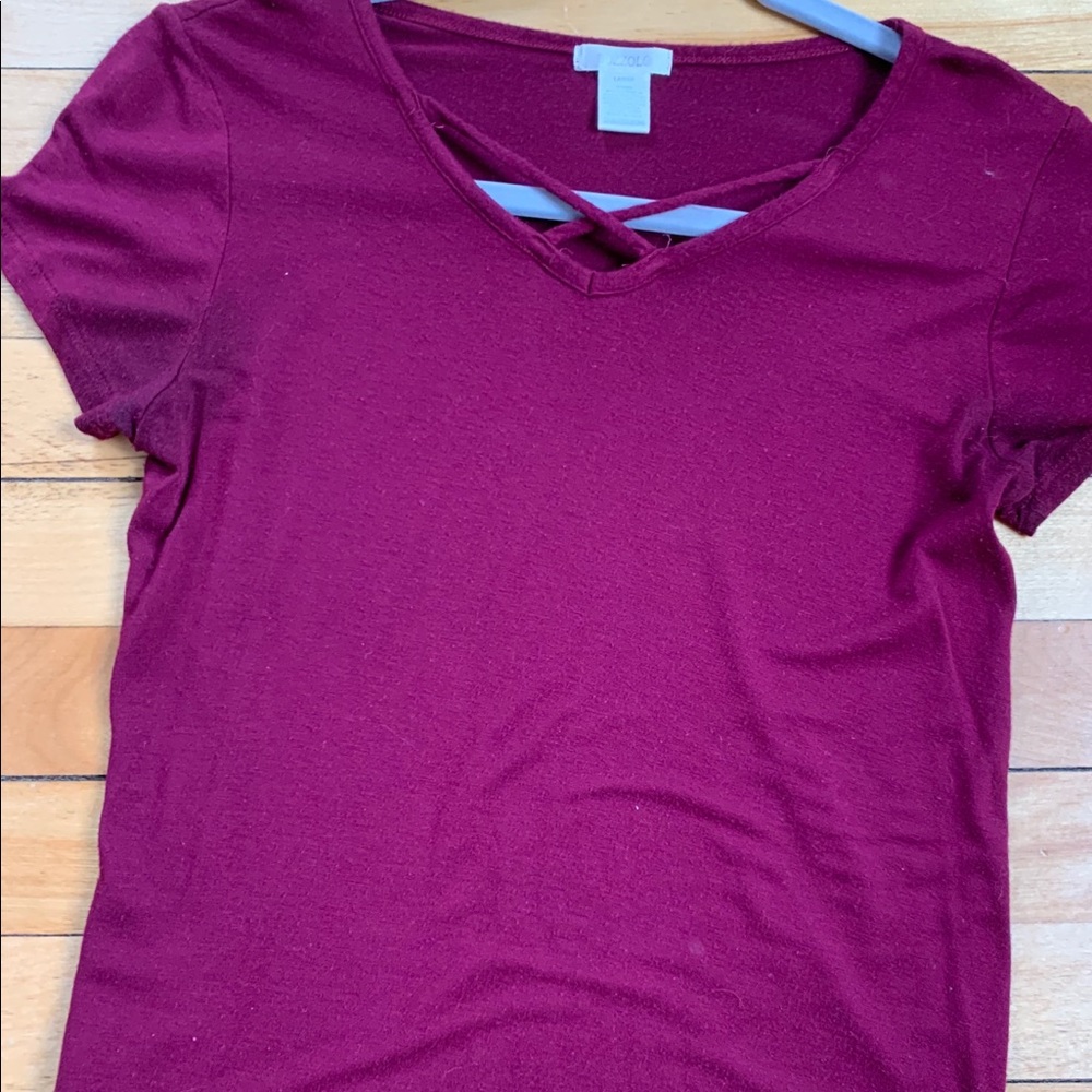 Tillys maroon shirt with cross detail on neckline